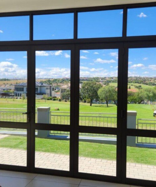 6-Panel-Folding-Door-in-Bronze-with-mid-rail-and-a-fixed-top-light-1
