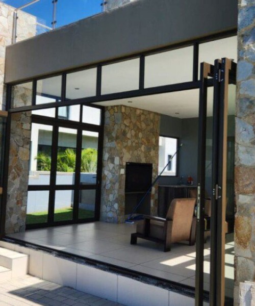 6-Panel-Folding-Door-in-Bronze-with-mid-rail-and-a-fixed-top-light